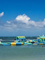 An inflatable water park beside a Panama beach
