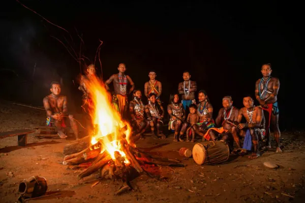 Embera community gathering around a bonfire