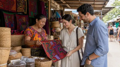 Visitors speaking with a Panamanian artisan at a market displaying colorful handmade textiles