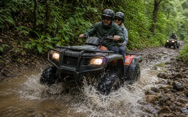 ATV riders splashing through a shallow Cerro Azul stream crossing