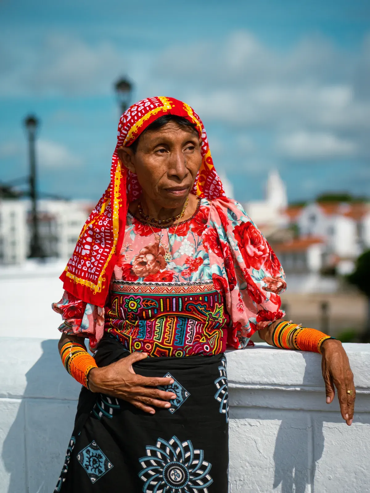 Guna artisan wearing traditional mola clothing at Las Bovedas