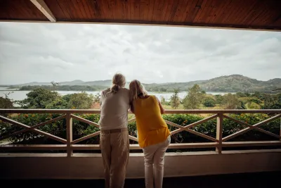 Travelers looking across Gatún Lake and the Gamboa rainforest